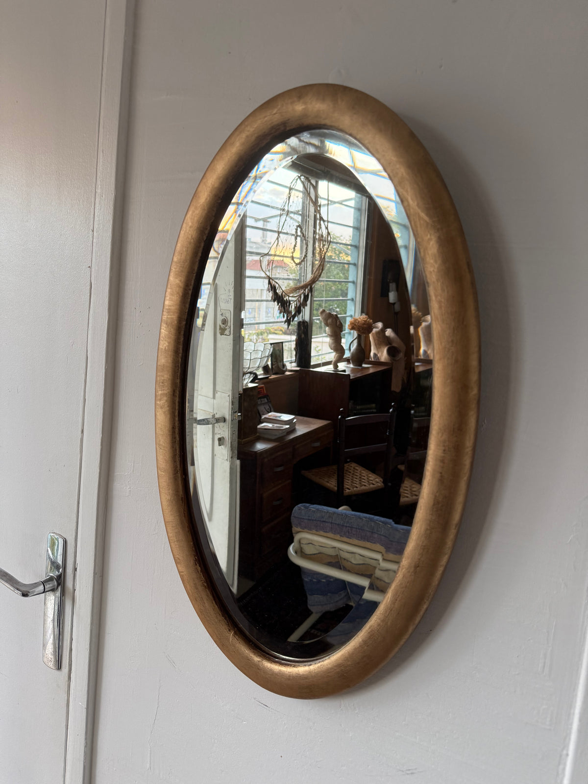 Miroir doré ovale ancien glace biseautée